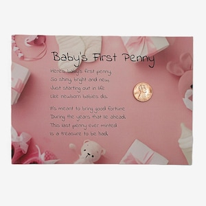 May include: A pink card with the text "Baby's First Penny" and a poem. The card is decorated with baby-themed items, including a penny, a teddy bear, and wrapped gifts.