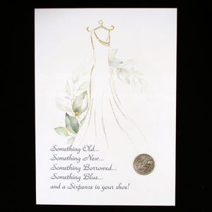 May include: A white wedding dress illustration with green leaves and a silver sixpence coin. The text reads "Something Old... Something New... Something Borrowed... Something Blue... and a Sixpence in your shoe!"