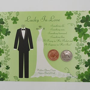 May include: A light green wedding card with the text "Lucky In Love" and a poem. The card features illustrations of a tuxedo, a wedding dress, and two coins. Green shamrocks decorate the borders.