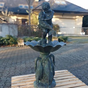 Bronze fountain "Boy with a fish"