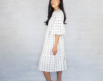 Midi dress with short bubble sleeves, two-tier skirt, pockets and a tie at the back