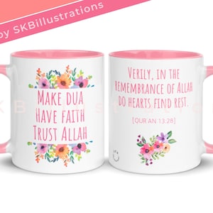 May include: White ceramic mug with a pink rim and handle. The mug features a floral design and the text "Make Dua Have Faith Trust Allah". The other side of the mug features the text "Verily, in the remembrance of Allah do hearts find rest. [QUR'AN 13:28]".