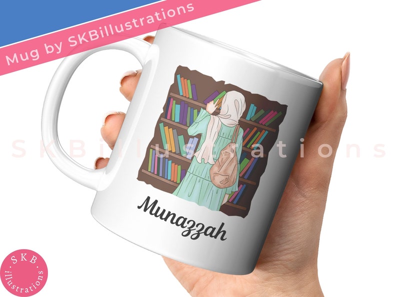 May include: White ceramic mug with a colorful illustration of a person in a hijab standing in a library, reading a book. The text "Munazzah" is printed on the mug.