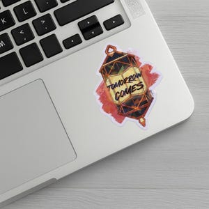 Mockup of the sticker on a laptop.