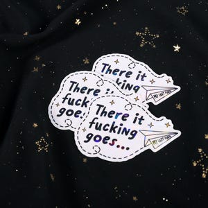 A sticker with the phrase "There it fucking goes..." and a small paper airplane graphic flying away that says "My Last Fuck"