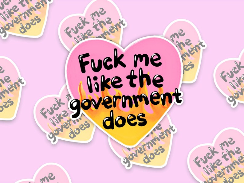 A flaming heart-shaped sticker with the text "Fuck me like the government does"