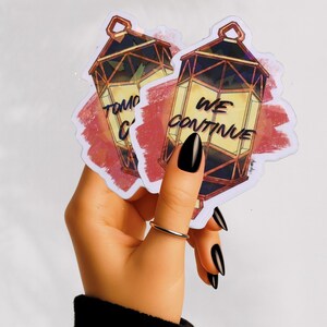 Mockup of Both stickers in Hand