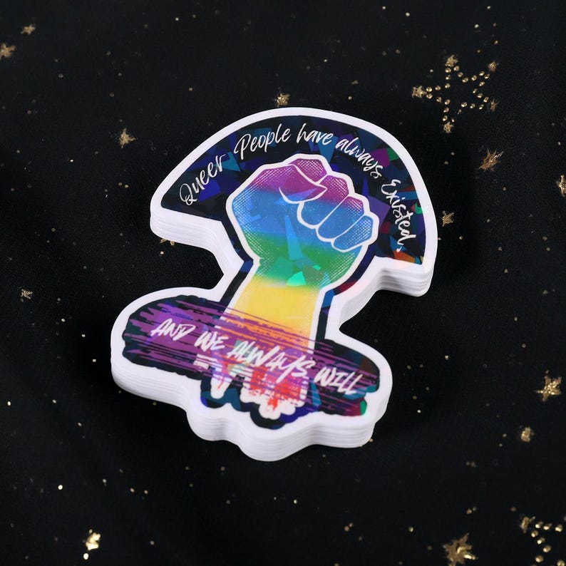 Queer People have always existed, and always will, Broken Glass Style Holographic 3 inch sticker, rainbow colored power fist on black background
