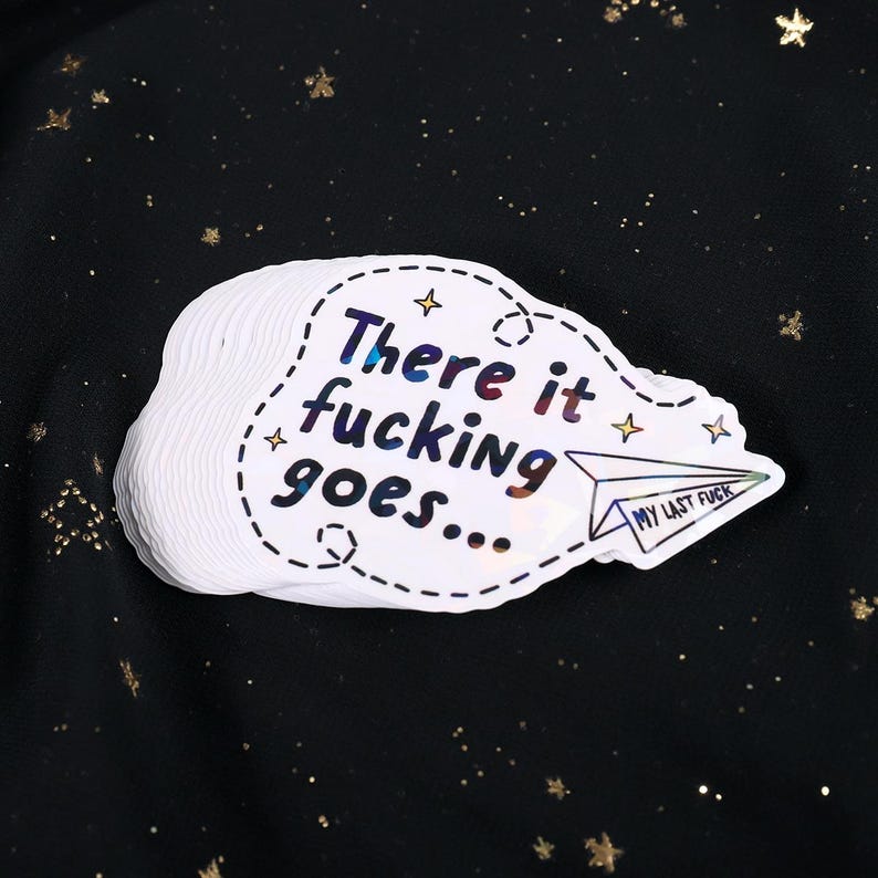 A sticker with the phrase "There it fucking goes..." and a small paper airplane graphic flying away that says "My Last Fuck"
