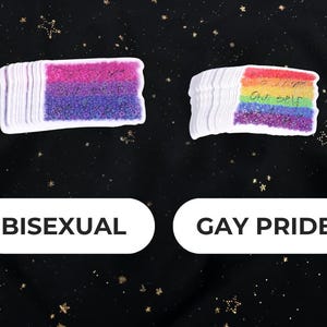 A Holographic Sticker of the Shakespeare quote from Hamlet "To Thine Own Self Be True" on the Bi And Gay Pride Flags