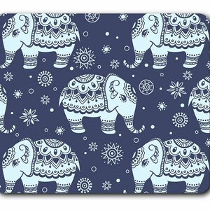 May include: A rectangular mouse mat with a repeating pattern of light blue elephants with ornate designs on a dark blue background. White star and circular patterns are interspersed between the elephants.