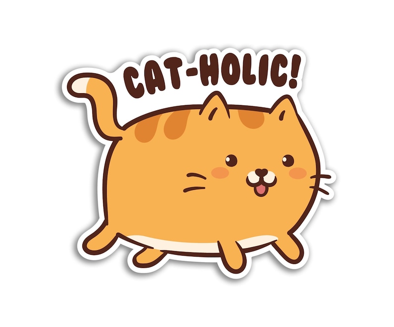 May include: A cartoon illustration of an orange cat with the text "CAT-HOLIC!" above it. The cat is smiling and has a pink nose and tongue.