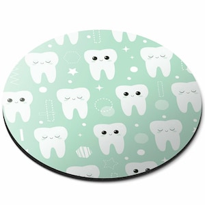 May include: A round mouse mat with a light green background and a repeating pattern of white cartoon teeth with closed eyes and smiling mouths. The teeth are surrounded by small white circles, stars, and geometric shapes.