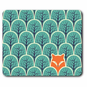 May include: A teal blue and white geometric pattern mouse mat with a stylised orange fox face in the centre.