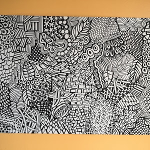 May include: Black and white abstract doodle art featuring a variety of patterns and shapes.