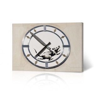 May include: A white clock face with black hands and a black rat stencil design. The clock face is surrounded by a silver rim with gold accents.