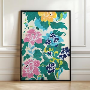 May include: A framed print featuring a colorful floral pattern with pink, blue, yellow, and green flowers on a white background.