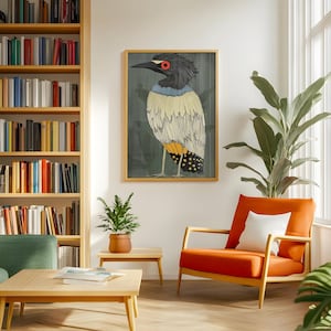 May include: A framed illustration of a bird with a black head, yellow and white feathers, and red eyes. The bird is standing on a branch with green leaves. The background is a dark green color.