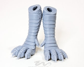 May include: A pair of grey, 3D printed dragon legs with claws. The legs are detailed with scales and have a textured surface.