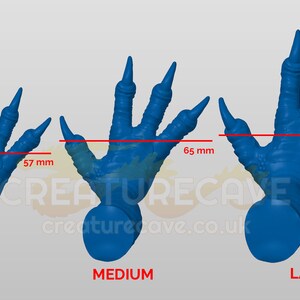 May include: Three blue plastic dinosaur claws in different sizes: small (57 mm), medium (65 mm), and large (74 mm).