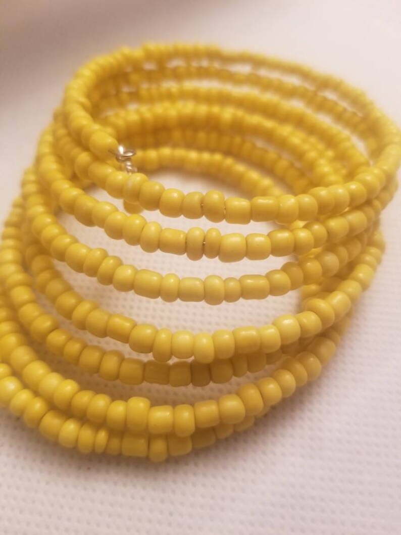 Yellow beaded cuff bracelet with 4 dangles. 19.99 Free Etsy