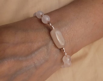 Beautiful genuine wire wrapped Rose Quartz bracelet.  One rectangle gemstone and round gemstones, with one dangle.
