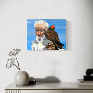 Arabian man holding a falcon