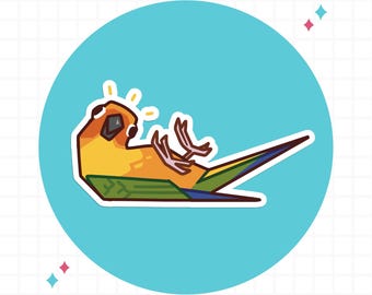 May include: A sticker featuring a stylized illustration of a yellow and orange parrot lying on its back with its feet in the air. The bird has green wings and a long tail with blue and green feathers, set against a bright blue circular background.