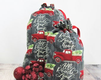 Sacchetti regalo in flanella con stampa di camion rossi, in cotone ecologico con coulisse