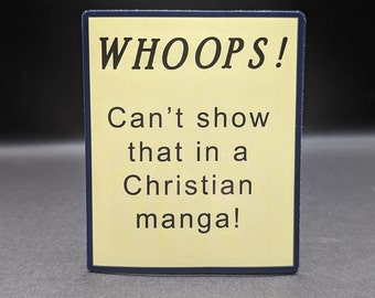 May include: A rectangular sign with a pale yellow background and a dark blue border. The sign features the word "WHOOPS!" in bold black letters, followed by the text "Can't show that in a Christian manga!" in black.