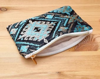 Boho chic makeup bag made of oriental fabric with geometric pattern in turquoise & black
