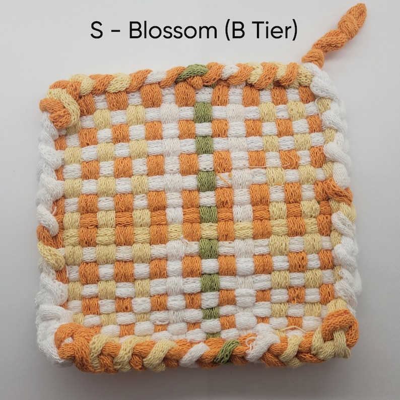 Small Blossom Potholder (B tier) In the colors white, orange, yellow and a little bit of green