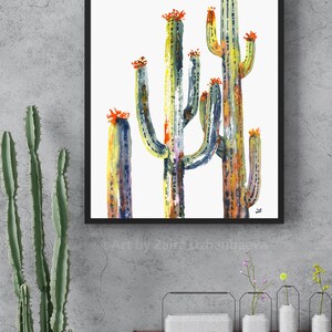 May include: A watercolor painting of a group of cacti in shades of green, yellow, and orange. The cacti are tall and slender, with a white background.