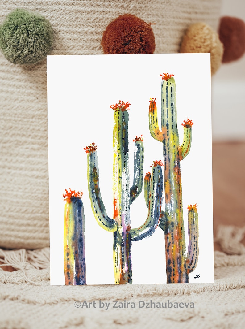 May include: Watercolor painting of a group of cacti with green, blue, yellow, and orange colors. The cacti are tall and slender with a white background.
