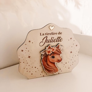 Wooden piggy banks for children to personalize with small animal in relief