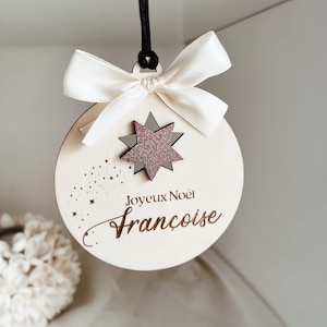 Christmas ball with personalized first name and white satin ribbon