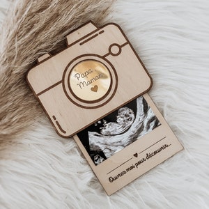 Pregnancy announcement in the shape of a camera and personalized ultrasound