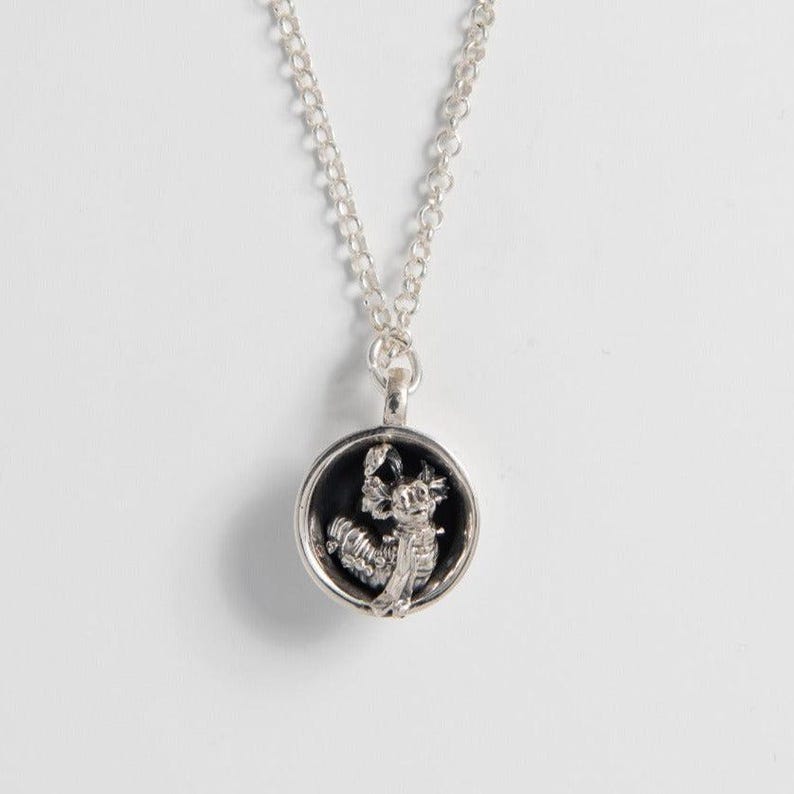 Sterling silver Labyrinth Worm in a Cup necklace with oxidised finish, shown on white background