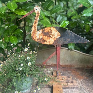 absolutely stunning rare chippy iron stork on wooden plateau, brocante