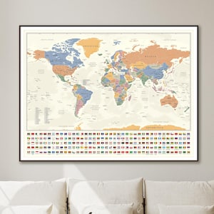 May include: Framed world map with a vintage aesthetic. The map features a detailed depiction of continents and countries in various colors, with a border of national flags at the bottom. The map is displayed on a wall above a white sofa.