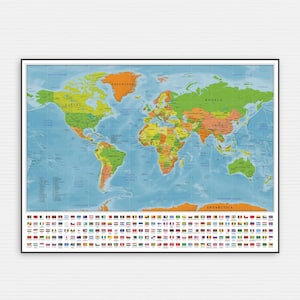 May include: A detailed world map print, featuring countries in various colours with their names clearly labelled. The map has a light blue ocean and a key of flags at the bottom. It is framed in black and mounted on a white brick wall.