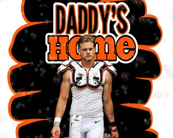 May include: A football player wearing a white jersey and black and white shoulder pads stands in front of a black and orange background. The text "DADDY'S Home" is written in orange and black letters.