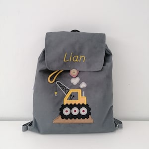 A personalized backpack for a preschooler, a backpack with a name, a backpack for kindergarten, a backpack with a crane