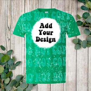 May include: Green t-shirt with a white circle that says "Add Your Design" in black text. The shirt has a bleach splattered design with the words "Do Not Copy" repeated.