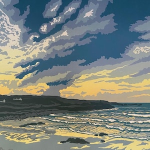 May include: A coastal scene painting shows a dramatic sky with blue and grey clouds. The ocean waves crash onto a sandy beach, with a dark shoreline and a hint of yellow sunlight breaking through the clouds.