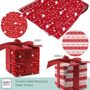May include: Double-sided Christmas wrapping paper sheets. One side features a red background with white snowflakes, reindeer, Christmas trees, and Santa's sleigh. The other side has a red and white pattern with reindeer and geometric shapes. A wrapped gift with a red bow is shown.