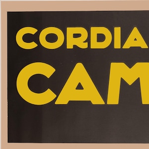 May include: A retro Campari liquor advertisement. The words "Cordial Campari" are in large, yellow, bold letters on a dark background. The word "liquor" is in smaller yellow letters below.