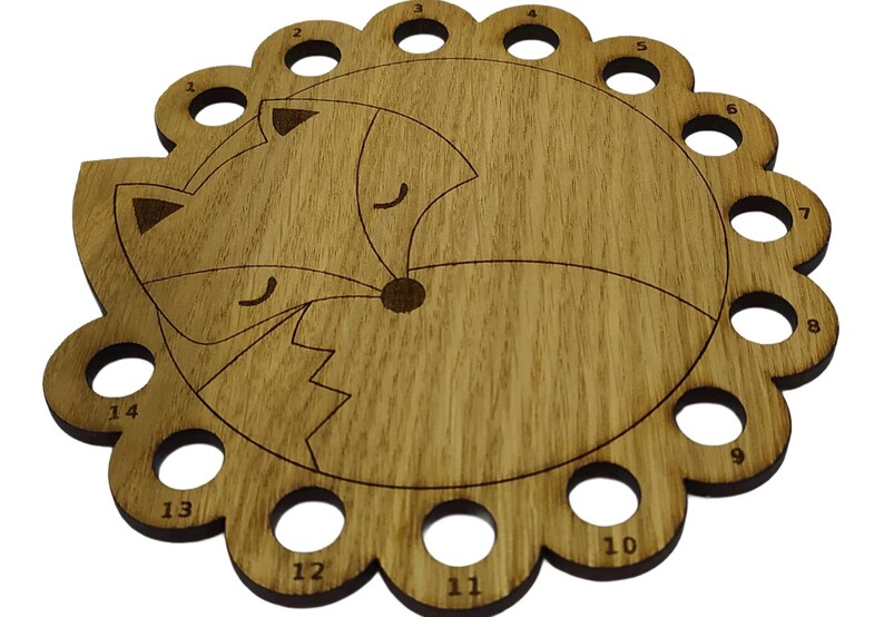 Curled up fox thread holder with 14 holes for thread
