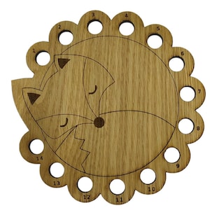 Curled up fox thread holder with 14 holes for thread