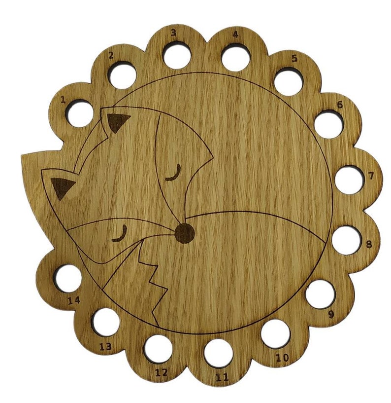 Curled up fox thread holder with 14 holes for thread